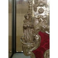 Child statue with halo on the head and sun on the chest